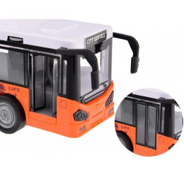 Oranžinis, didelis autobusas su šviesomis ir garsais